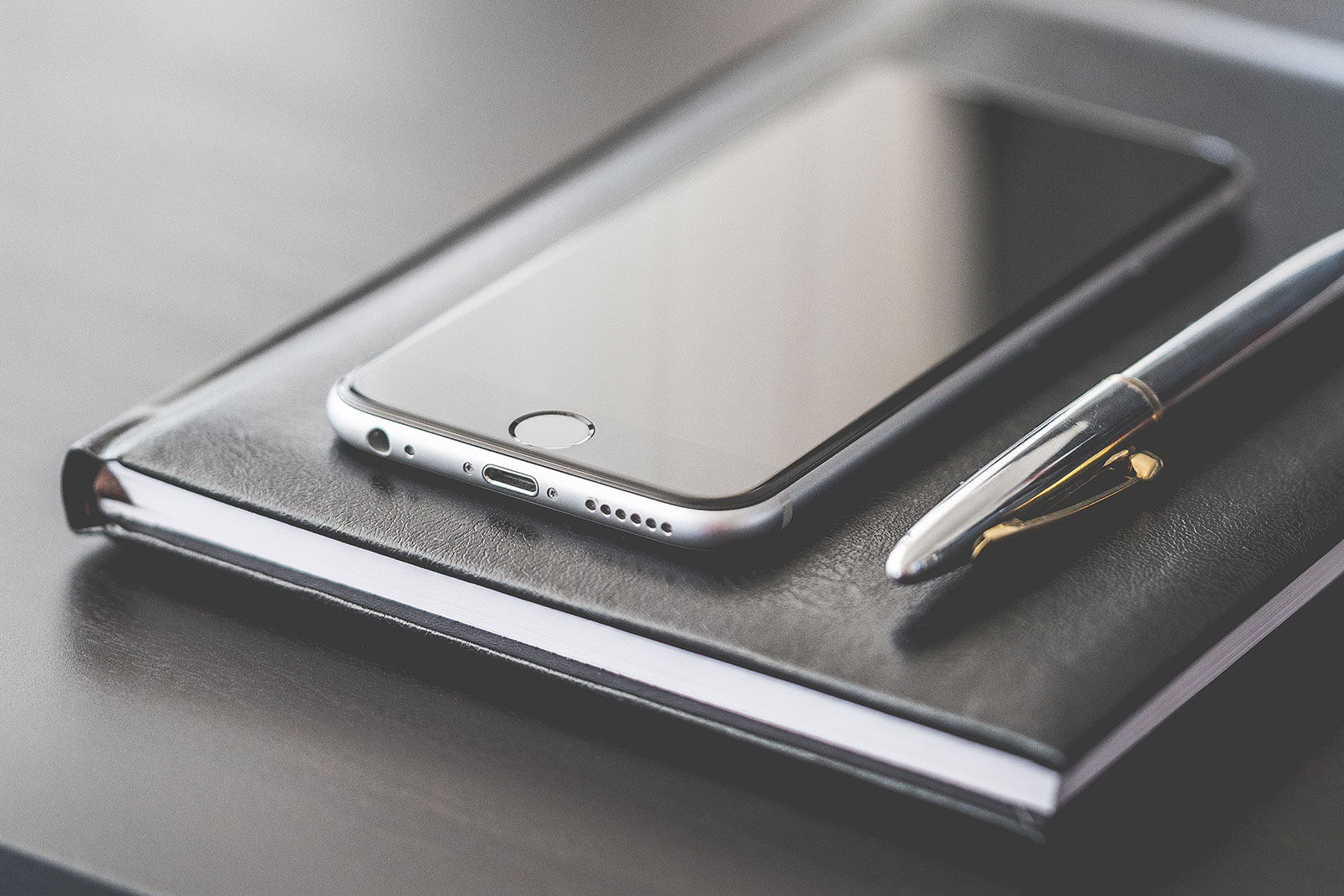 A Super Business Gear: Smartphone, Silver Pen & Diary